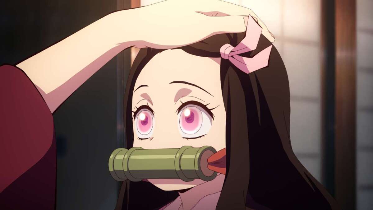 Nezuko Kamado getting a pat on her head in "Demon Slayer"