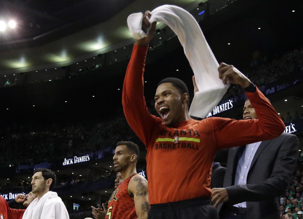 Hawks forward Kent Bazemore cheers from the bench during the third quarter against the Celtics in Game 6.