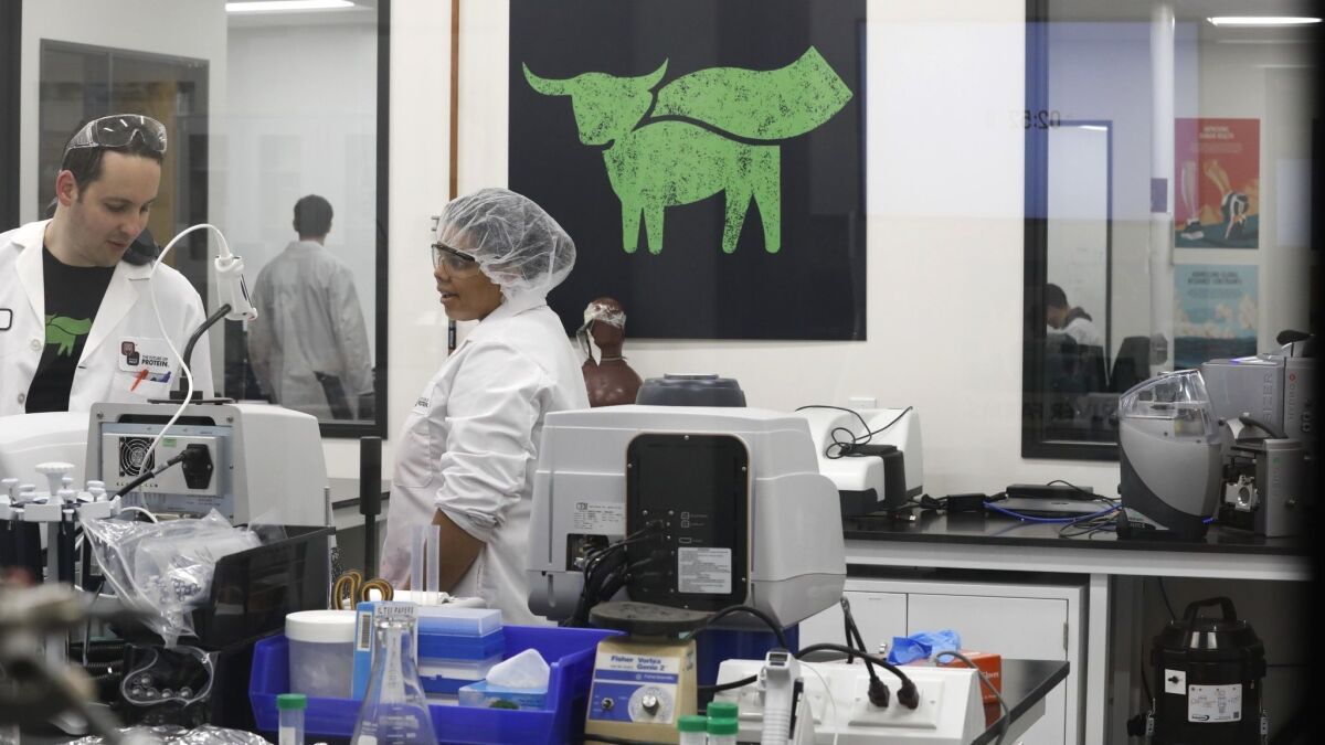 A scientist, left, and a lab technician work in the lab where plant-based products for Beyond Meat are tested for protein analysis, flavor, texture and protein purification.
