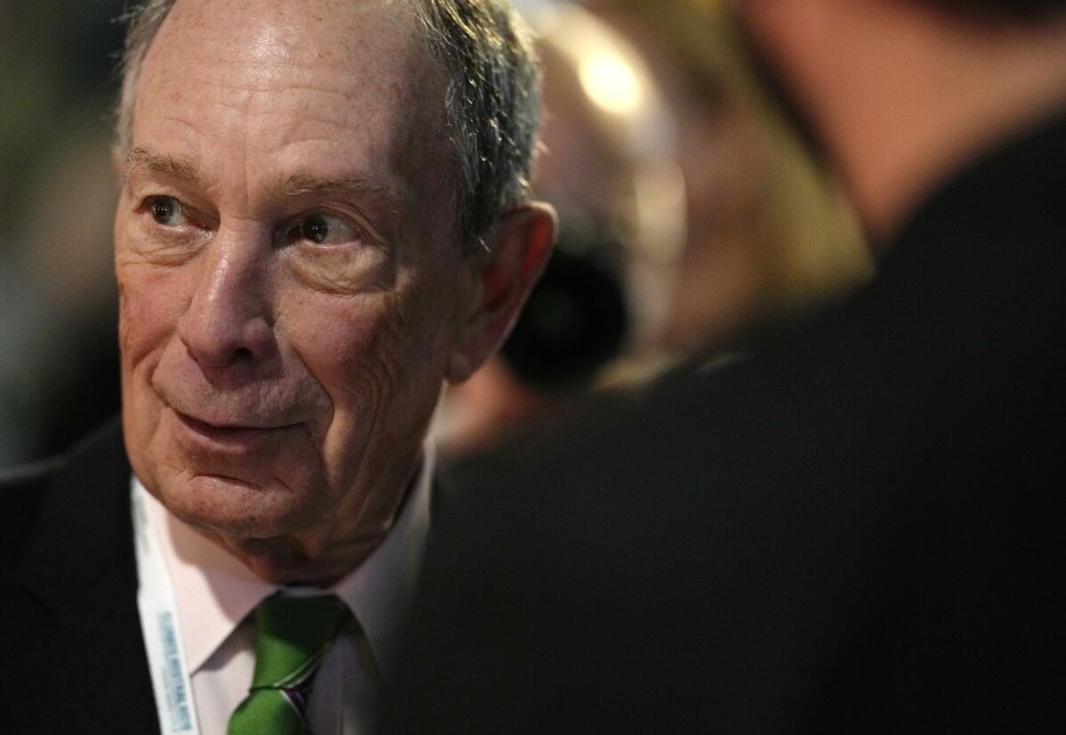 FILE - U.S. businessman Michael Bloomberg speaks with participants prior to a meeting with Earthshot prize winners and finalists at the Glasgow Science Center in Glasgow, Scotland, Tuesday, Nov. 2, 2021. Bloomberg will spend $120 million in an effort to reduce the soaring numbers of deaths from drug overdoses, he announced Wednesday, Nov. 10, 2021 at a healthcare summit he organized. The pledge more than doubles the $50-million philanthropic commitment he made toward the same goal in 2018. (AP Photo/Alastair Grant, Pool)