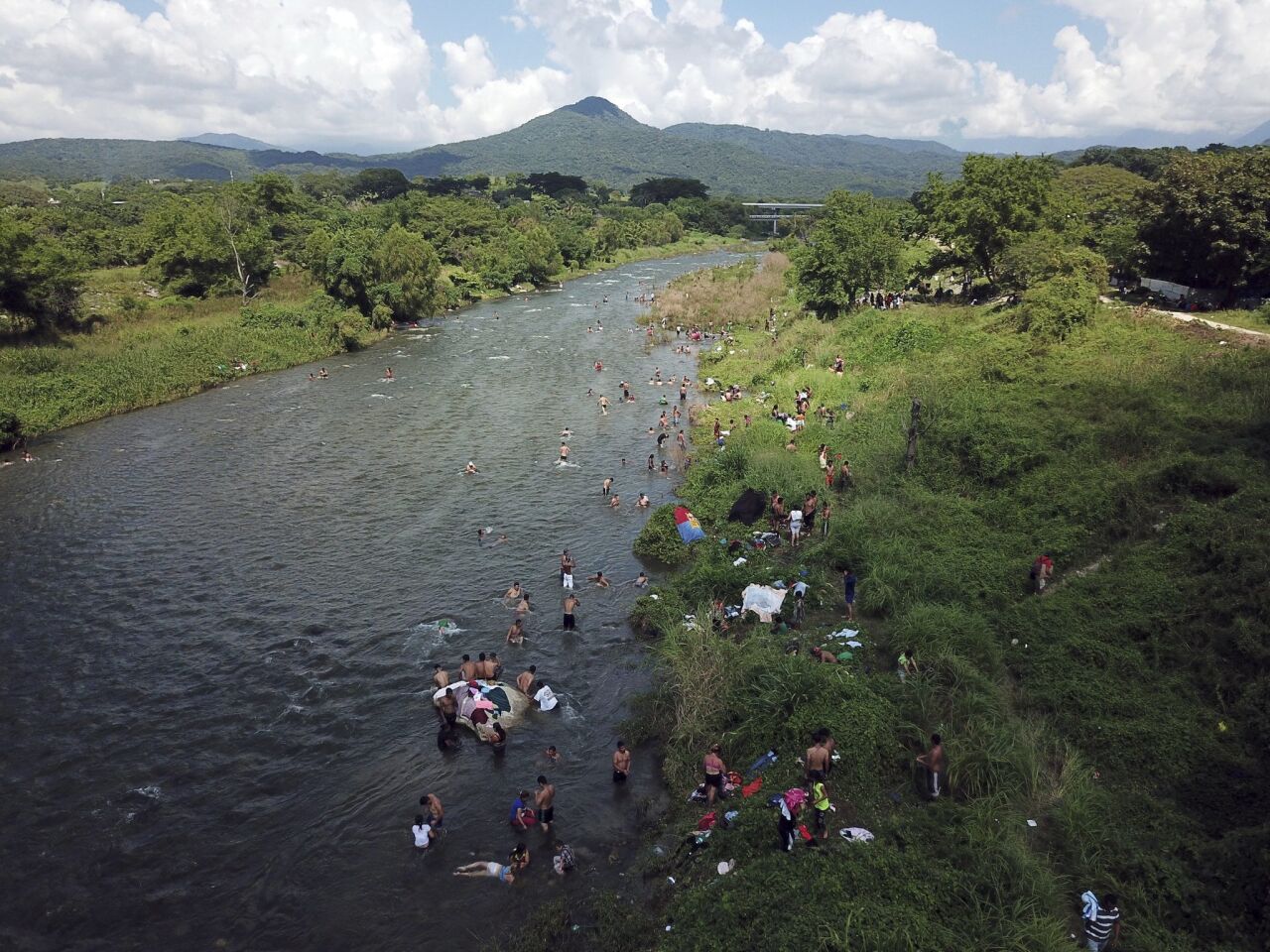 Honduran migrants take a bath in a river in Pijijiapan, Mexico.