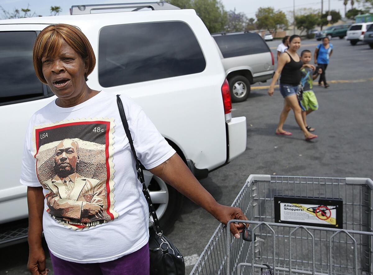 Compton resident Ellen Harris, outside a supermarket, says, "We are not all criminals in Compton."