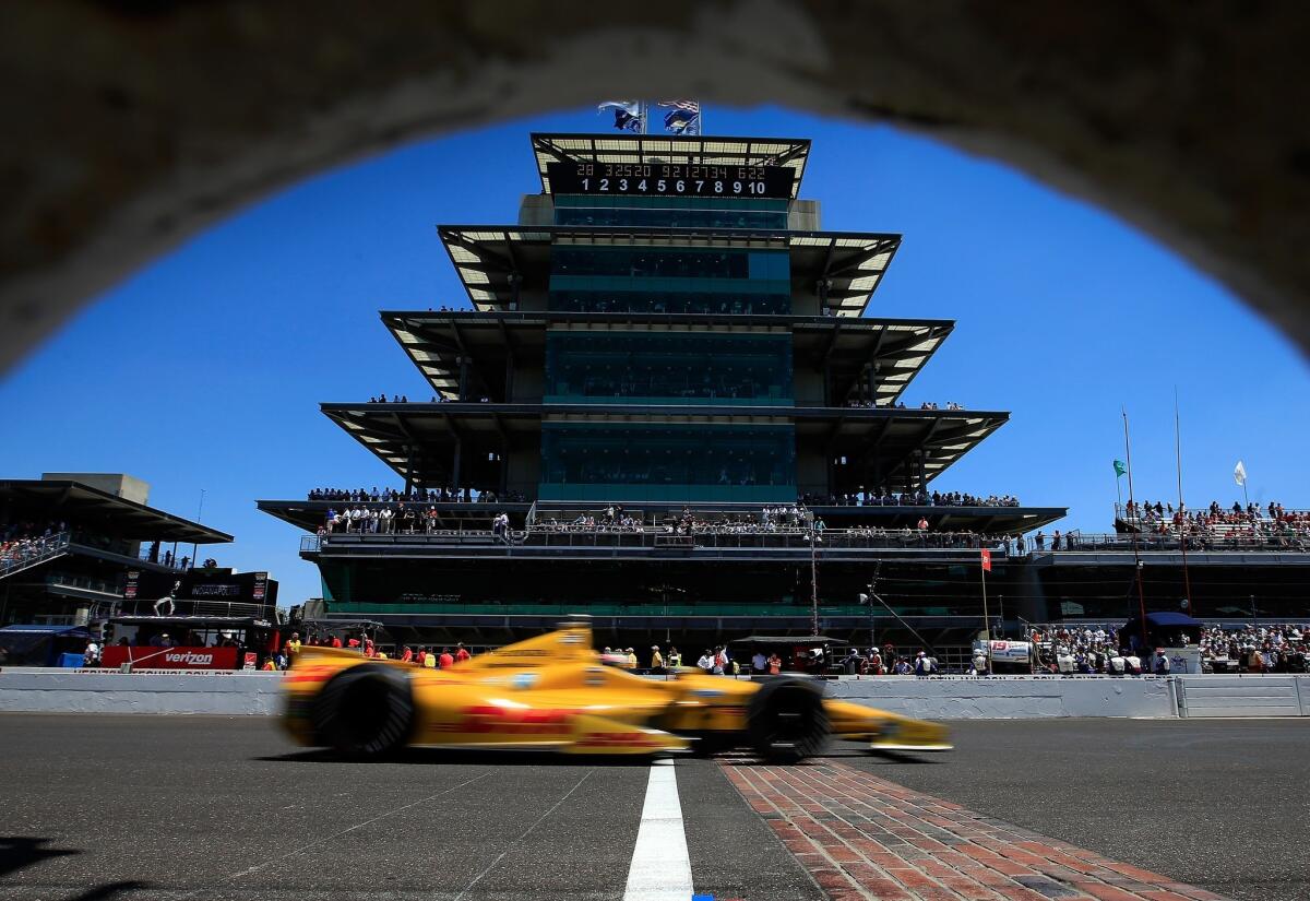 Ryan Hunter Reay guides his car arcoss the finish line in front of the pagoda-style center at Indianapolis Motor Speedway on May 25, 2014. 