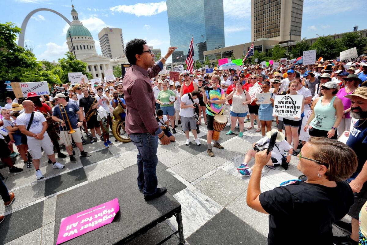 In this June 30, 2018, photo, Wesley Bell addresses the crowd during a protest in downtown St. Louis.