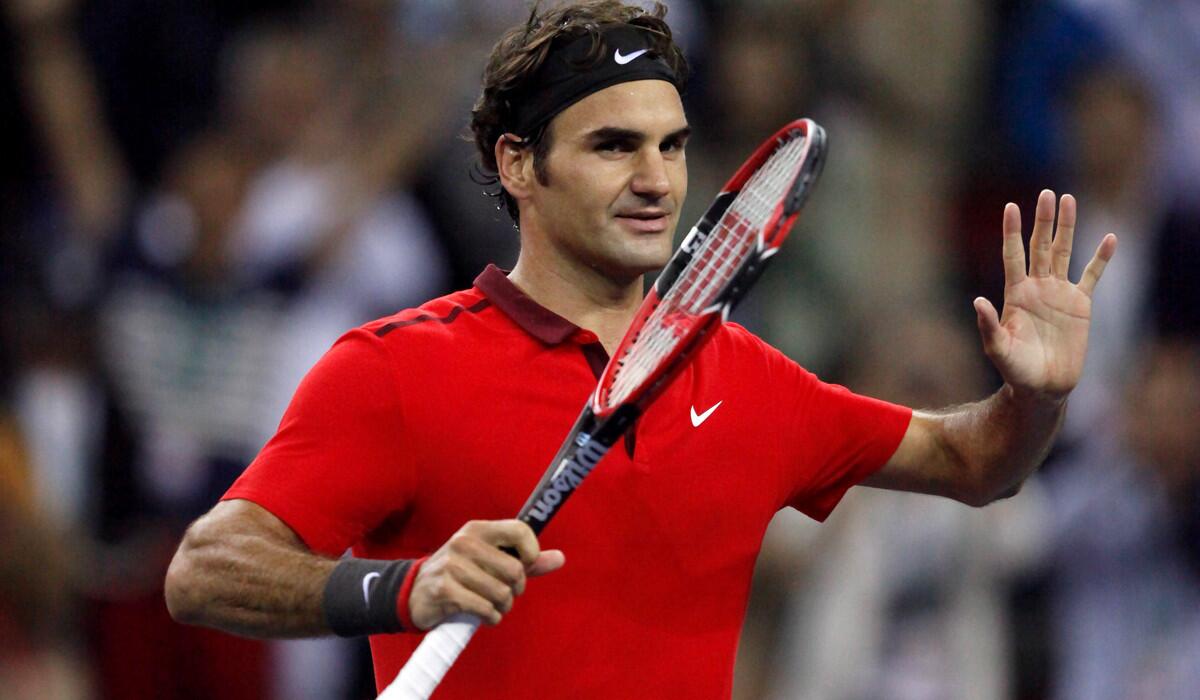 Roger Federer acknowledges the cheers of spectators after defeating Novak Djokovic in the semifinals of the Shanghai Masters on Saturday.