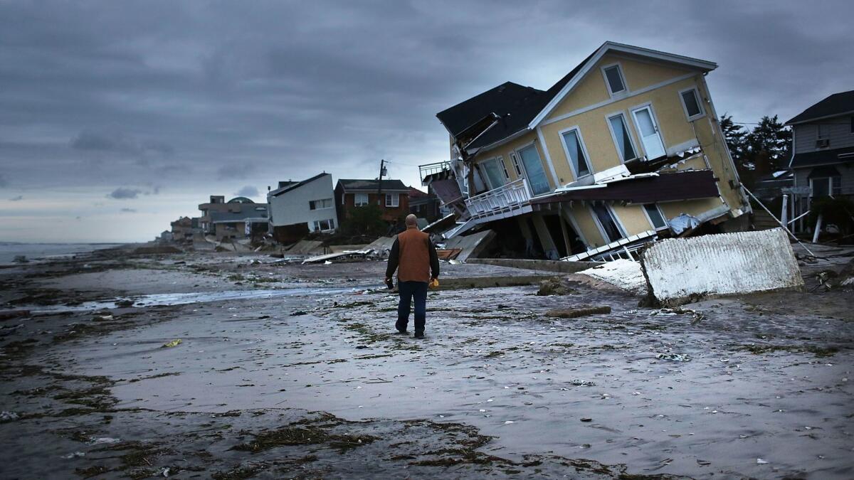 Damage is viewed in the Rockaway neighborhood of the Queens borough of New York City, where the historic boardwalk was washed away during Hurricane Sandy. (Spencer Platt / Getty Images)