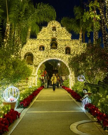 The entryway at the historic Mission Inn is decorated with poinsettias and holiday lights.