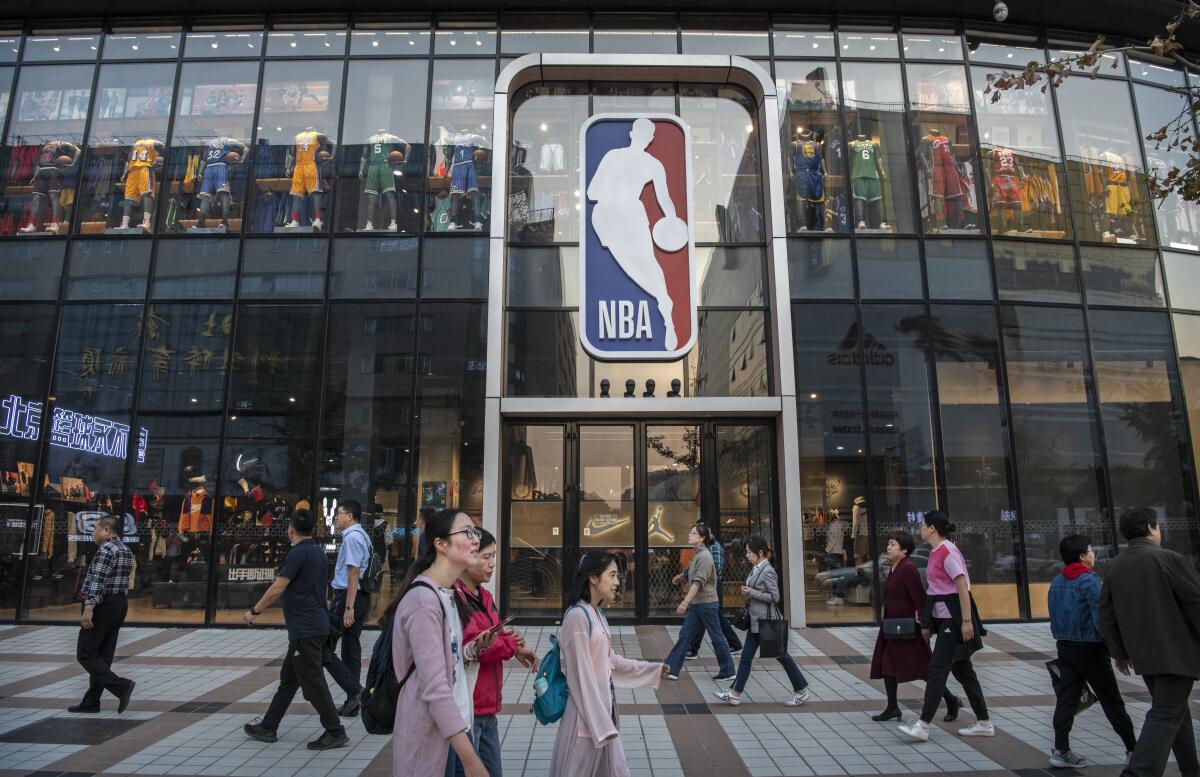 Back to business as usual? The Chinese government has toned down its criticism of the NBA. Above, the league's flagship retail store in Beijing.