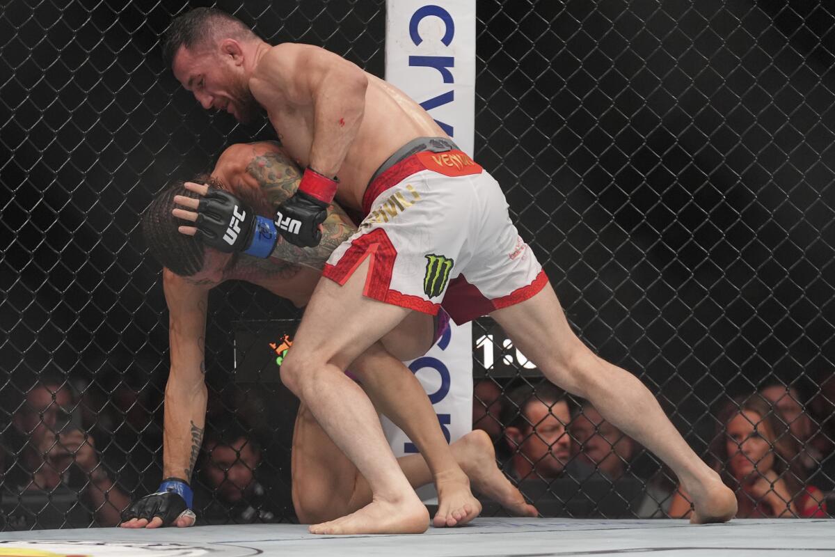 Georgia's Merab Dvalishvili, right, grapples with Sean O'Malley