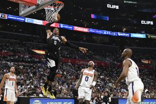 LOS ANGELES, CA -APRIL 22, 2023: LA Clippers guard Russell Westbrook (0) dunks over Phoenix Suns.