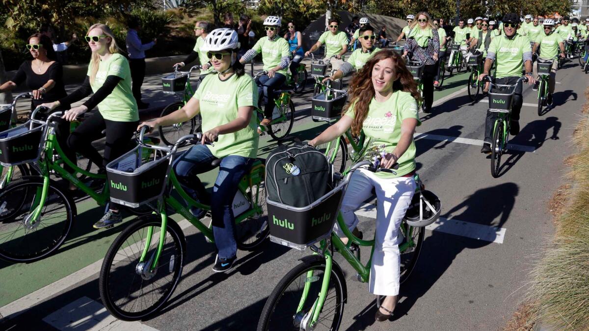 Riders try out Santa Monica's new bike-share system, Breeze, on the day of its launch last year.