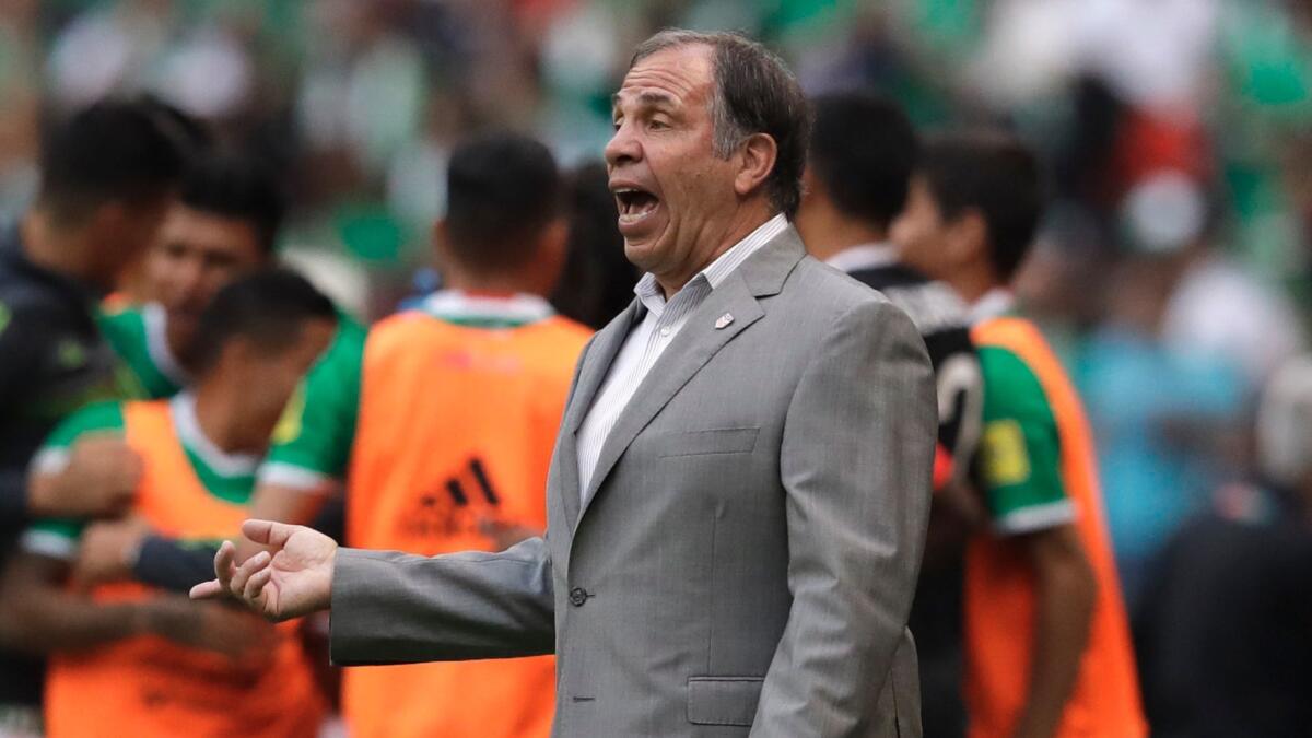 U.S. coach Bruce Arena gives instructions to his players during a World Cup qualifying match against Mexico in Mexico City on June 11.