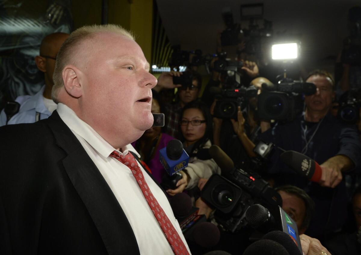 Toronto Mayor Rob Ford talks to the media at City Hall after the city's police chief disclosed that authorities recovered a digital video from a computer hard drive that purportedly shows Ford smoking what appears to be crack cocaine.