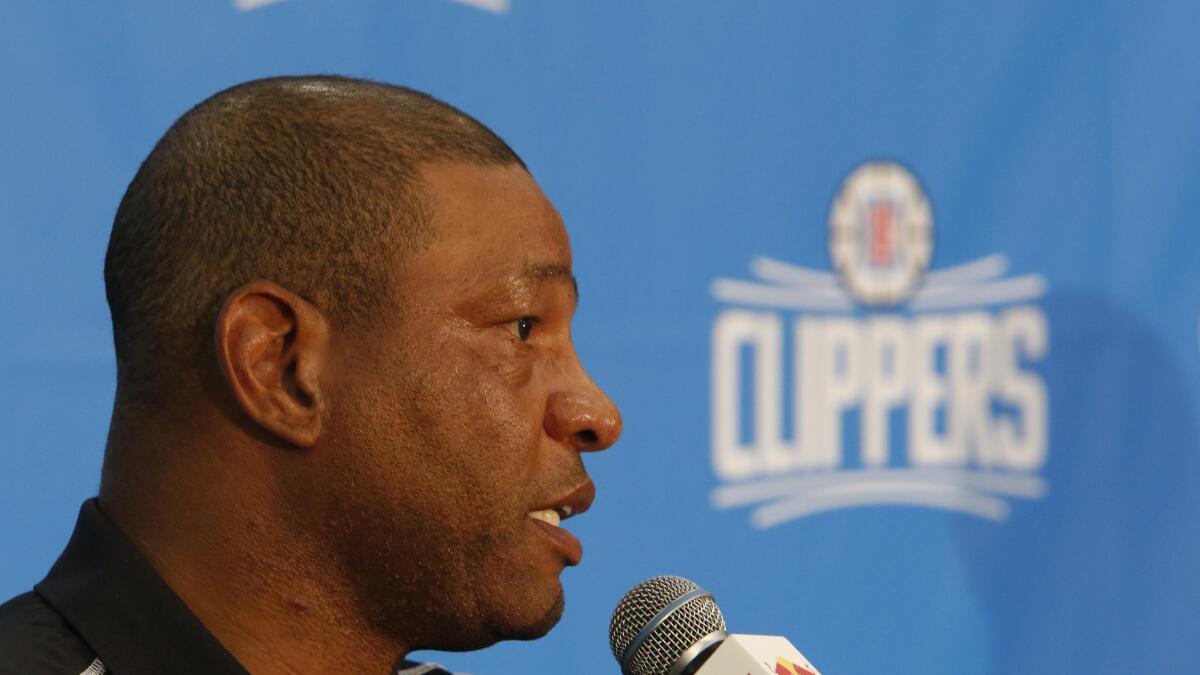 Clippers Coach and President of Basketball Operations Doc Rivers talks during a news conference at the team's training facility.