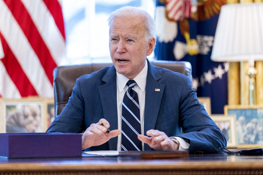 FILE - President Joe Biden speaks before signing the American Rescue Plan, a coronavirus relief package, in the Oval Office of the White House, March 11, 2021, in Washington.It's been one year since President Joe Biden signed into law the American Rescue Plan. The $1.9 trillion package of relief measures was designed to fight the coronavirus pandemic and help the economy rebound. (AP Photo/Andrew Harnik, File)