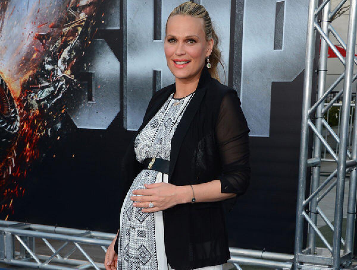 Molly Sims, who is married to "Battleship" producer Scott Stuber, welcomed a baby boy Tuesday.