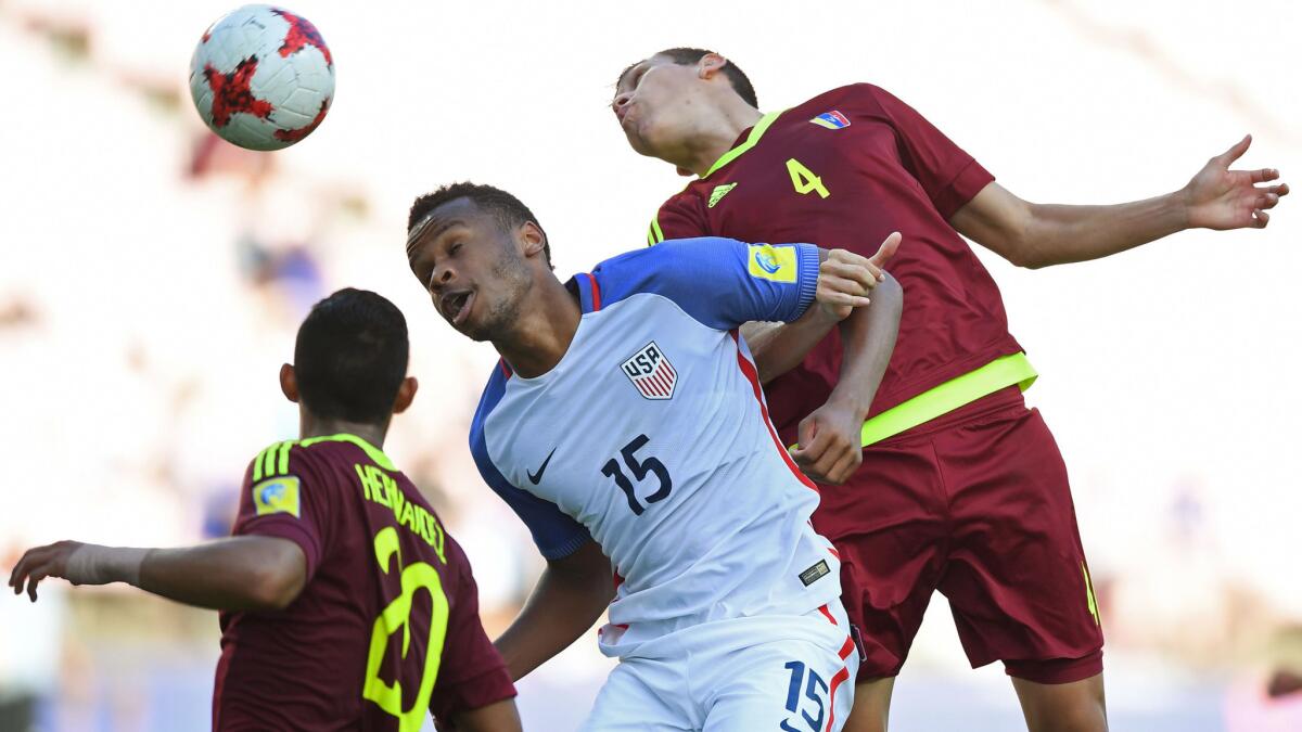 US forward Jeremy Ebobisse (15) battles Venezuela's Nahuel Ferraresi and Ronald Hernandez for a header during their Under-20 World Cup quarterfinal on Sunday.