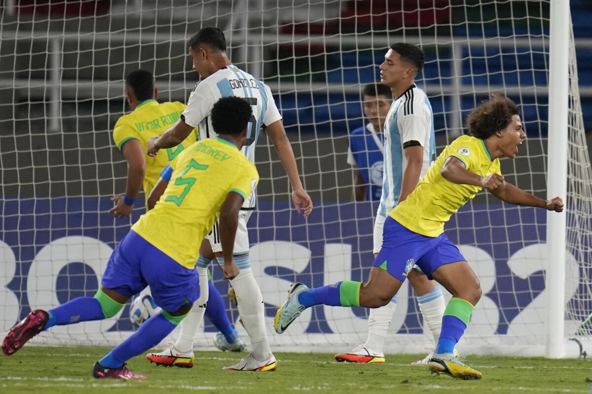 Brazil's Guilherme, right, celebrates scoring the opening goal during a South America U-20 Championship soccer match against Argentina in Cali, Colombia, Monday, Jan. 23, 2023. (AP Photo/Fernando Vergara)