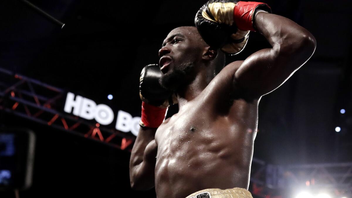 Terence Crawford celebrates after stopping Felix Diaz on Saturday night.