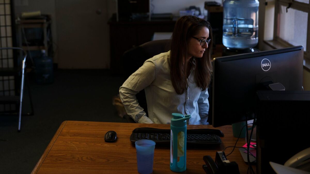 Elisabeth Franks at her desk, where she was working when the bomb threat was called into the Westside Jewish Community Center.