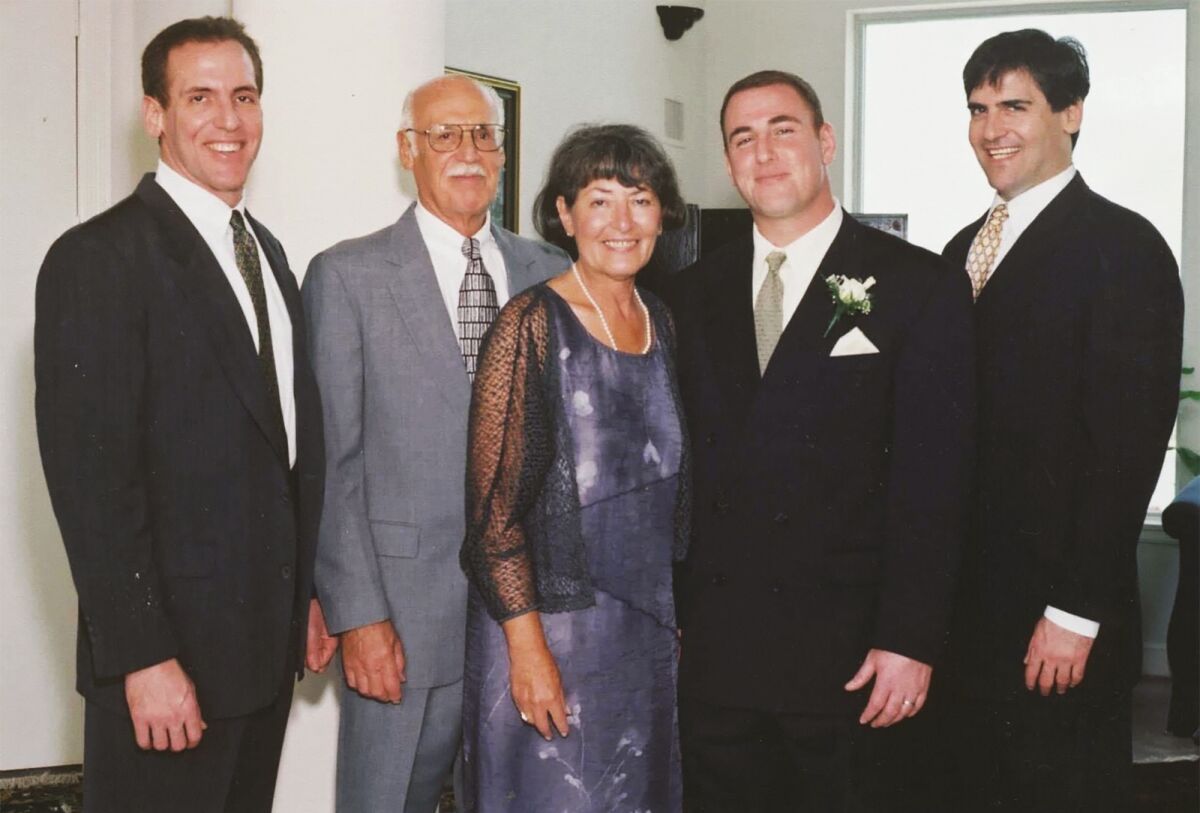 In this undated photo provided by the Cuban family, Shirley Cuban poses with her husband, Norton Cuban, second from left, and their sons, Brian, left, Jeff, second from right, and Mark. Shirley Cuban, the mother of Dallas Mavericks owner Mark Cuban, died Friday, Feb. 4, 2022, in the suburban Pittsburgh home where she and Norton, raised their sons, The Dallas Morning News reported. Brian Cuban said his mother died after a long battle with lung cancer. She was 84. (Courtesy of the Cuban Family)