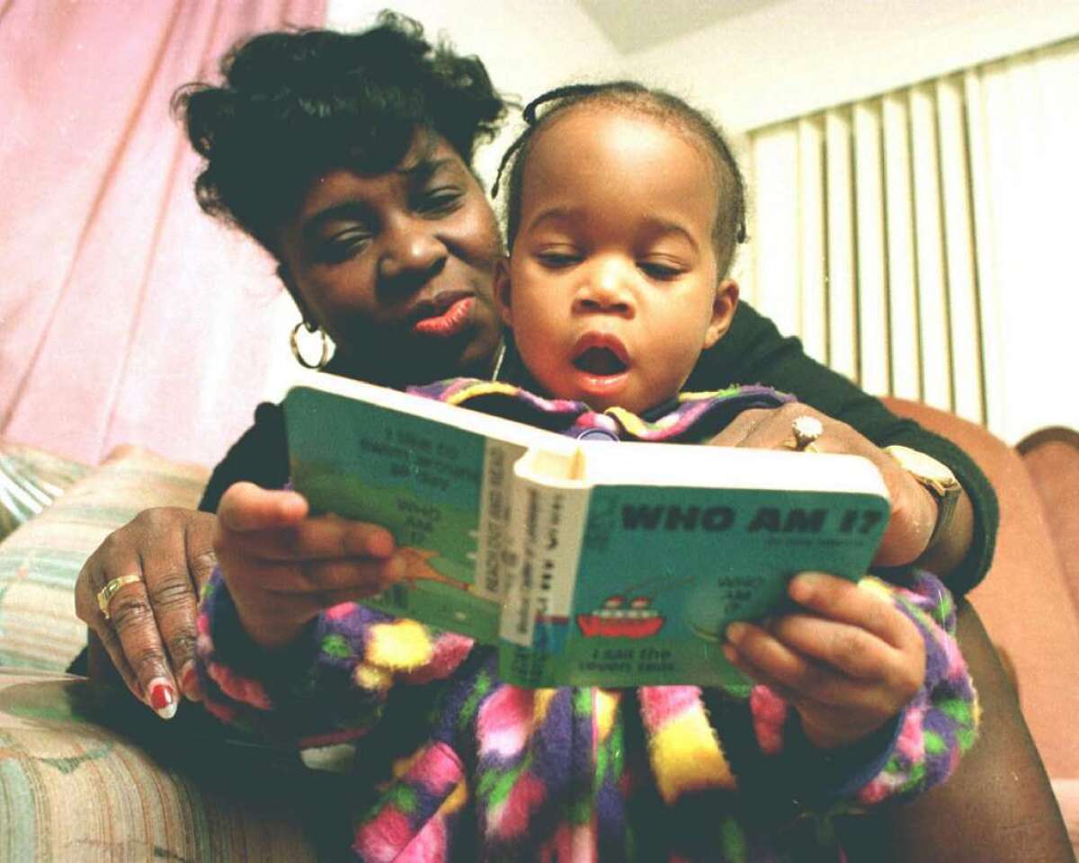 Karen Wilson reads to her daughter Gecaria in New Orleans. A new policy statement from the American Academy of Pediatrics urges parents to read to their young children every day, starting in infancy.
