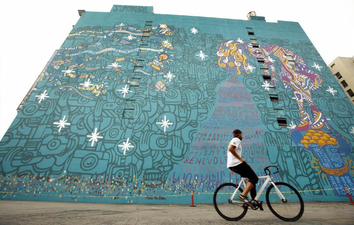 A huge mural on the wall of the Santa Fe Building at 539 S. Los Angeles St. in downtown L.A. has been saved, at least for now.