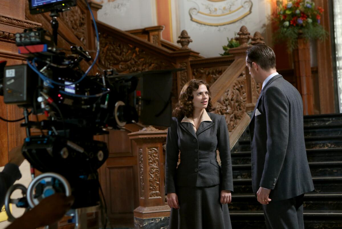 A report from FilmLA Inc. found that while feature film production in Los Angeles County dropped during the first quarter, film productions for TV dramas has increased. Above, Hayley Atwell and James D'Arcy on the set of Marvel's "Agent Carter" on location in Beverly Hills.