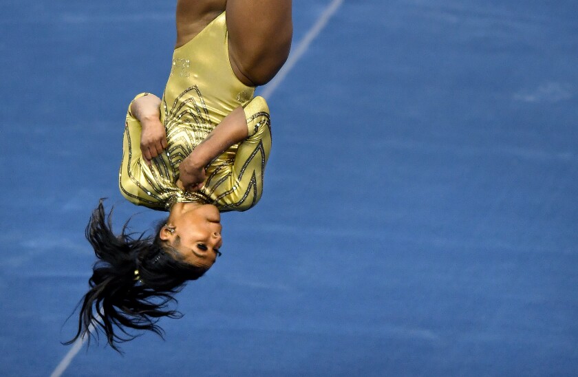 UCLA's Nia Dennis performs her floor routine against Brigham Young at Pauley Pavilion on Feb. 10, 2021.