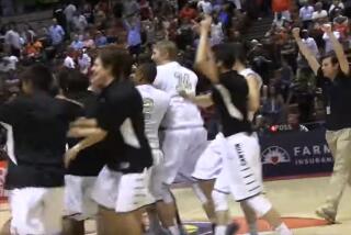 Anaheim Canyon players celebrate after rallying from 22-point fourth-quarter deficit to defeat Lawndale 103-98 in double overtime in the 2015 Division 2AA championship game.