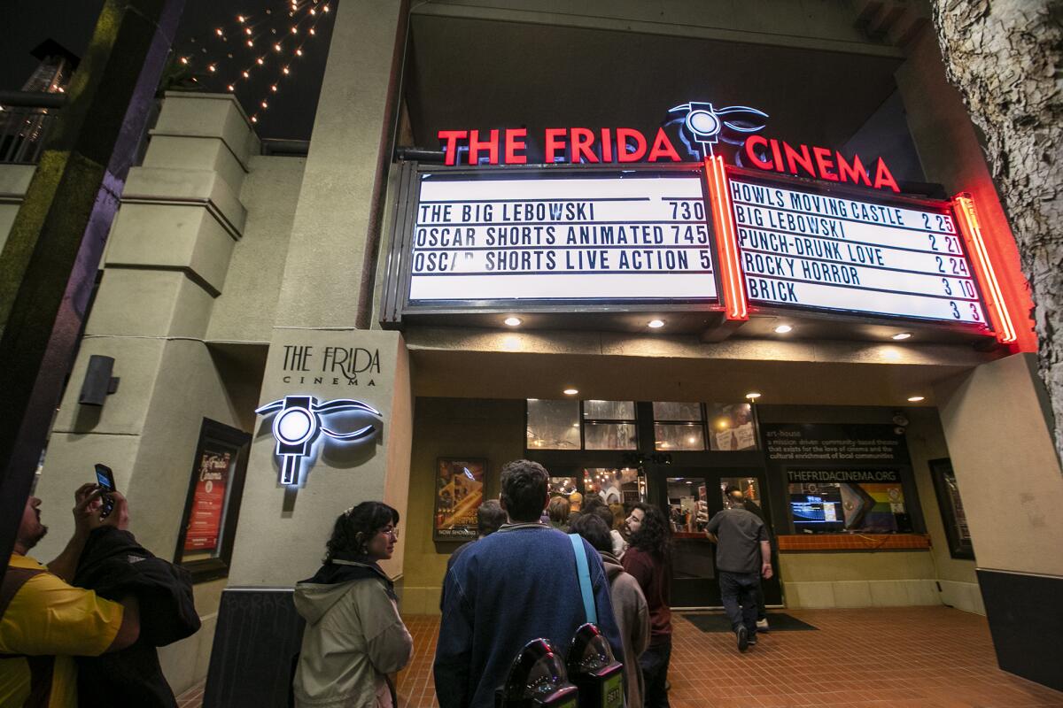 Guests line up outside the Frida Cinema on Tuesday, Feb. 21, 2023 in Santa Ana.