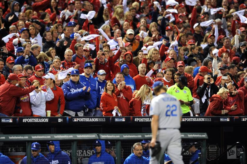 Dodgers pitcher Clayton Kershaw comes out of the game against the Cardinals in game 6 of the NLCS