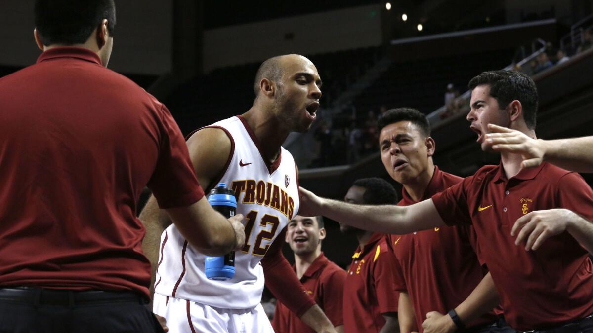 USC guard Julian Jacobs celebrates after a dunk against Colorado on Feb. 17.