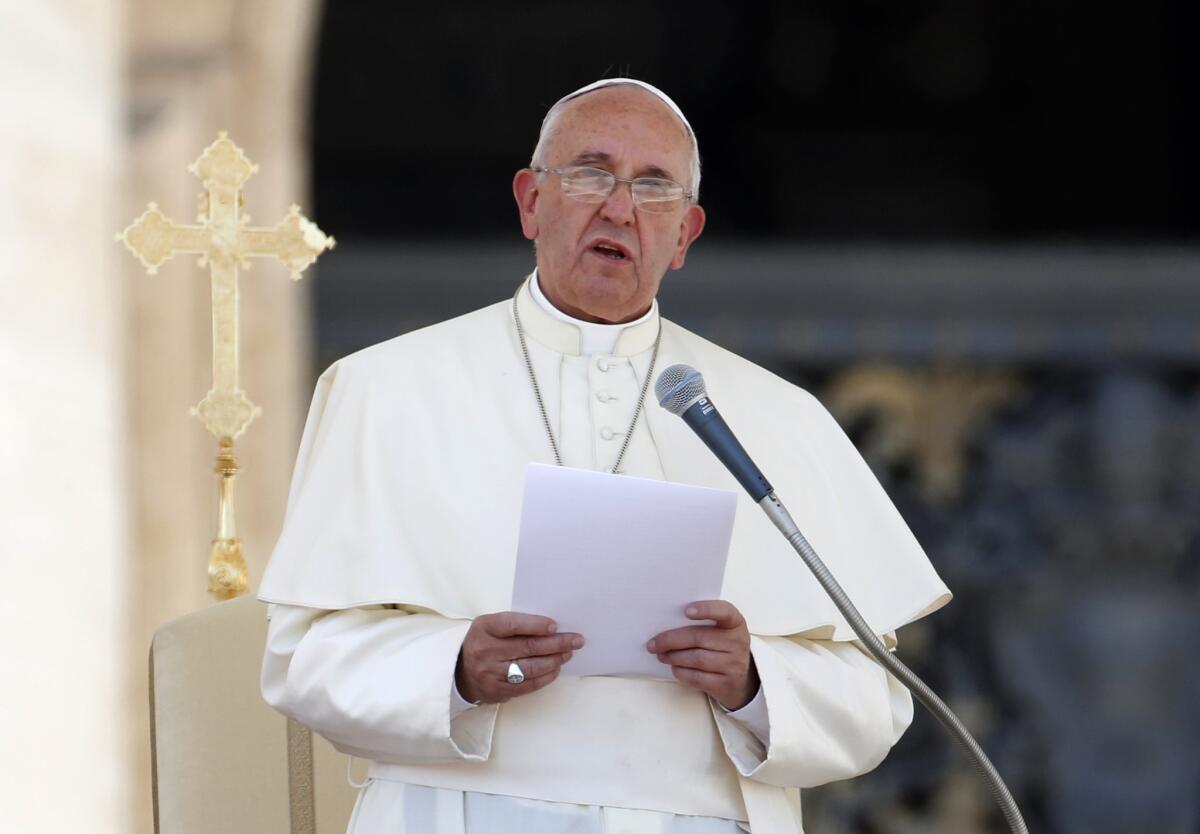 Pope Francis speaks in St. Peter's Square at the Vatican earlier this month.