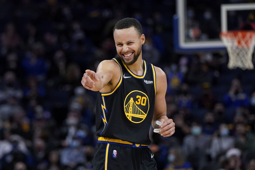 Golden State Warriors guard Stephen Curry celebrates during the second half of the team's NBA basketball game against the Portland Trail Blazers in San Francisco, Wednesday, Dec. 8, 2021. (AP Photo/Jeff Chiu)