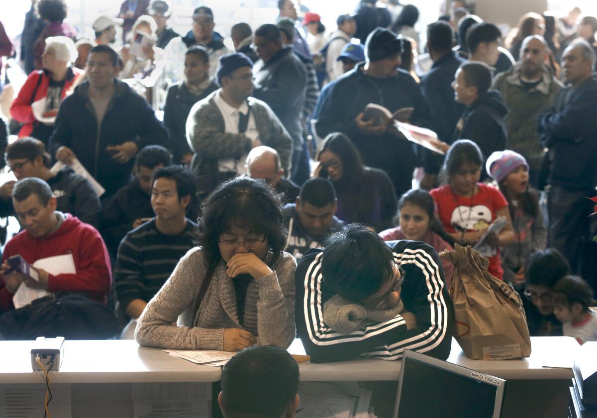 Hundreds of people showed up at the DMV office in Stanton for an opportunity to get their driver's licenses on Jan. 2, the first day people without legal immigration status could apply for a California driver's license.