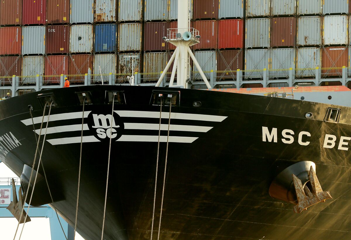 A crew member aboard a container ship