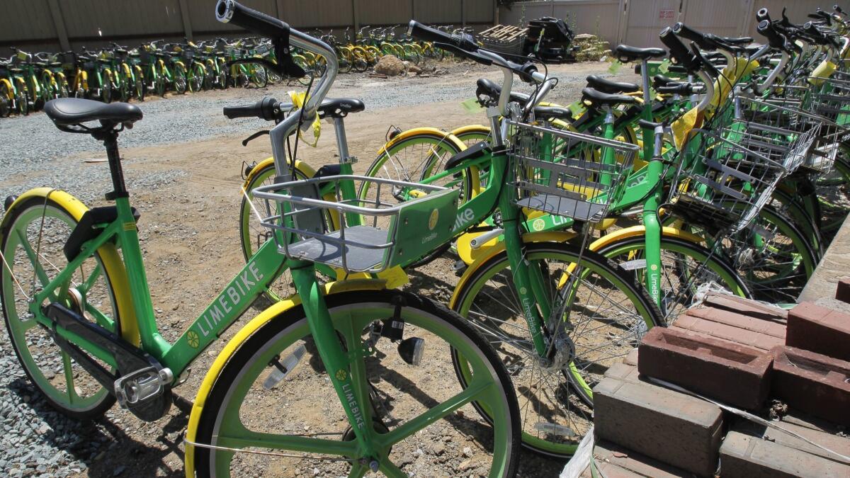 Over 100 dockless bikes that have been impounded remain at a storage yard in Coronado.