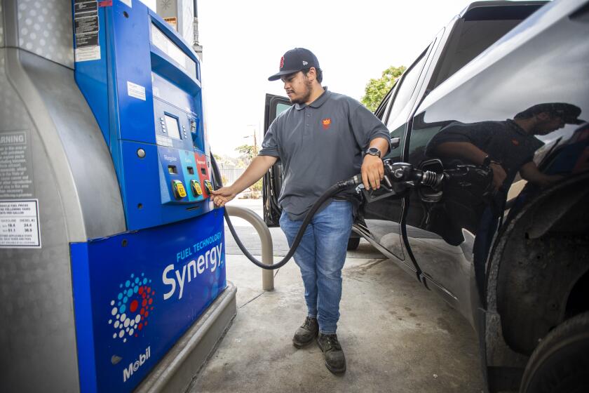 PASADENA, CA - APRIL 28: Mario Beccera, of Fontana, fills up his gas tank at a Mobil gas station on Thursday, April 28, 2022 in Pasadena, CA. Millions of California families would receive cash rebates of $200 per person under a plan unveiled Thursday by state Senate Democrats, with additional boosts to those enrolled in government assistance programs and subsidies provided to small businesses that could be extended for a decade.(Francine Orr / Los Angeles Times)
