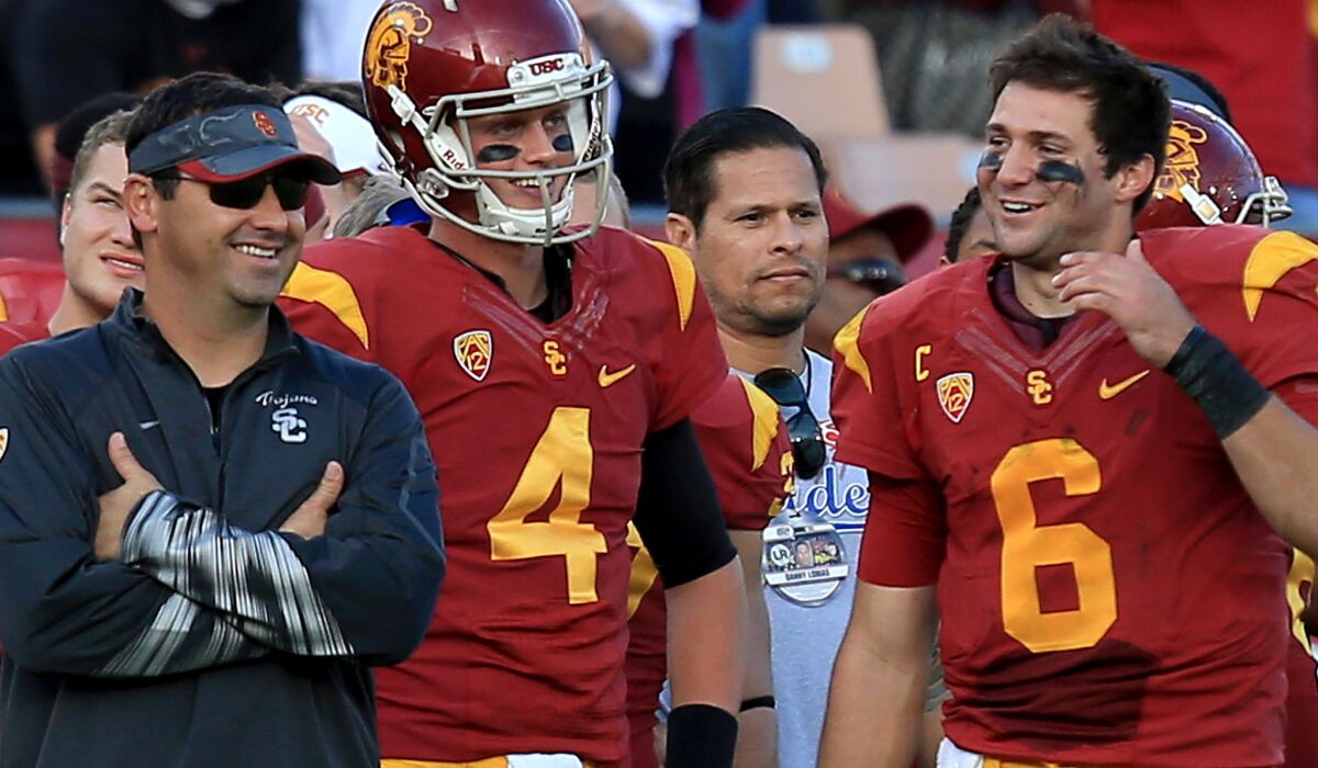 Max Browne (4) is among the candidates to be the backup to starting quarterback Cody Kessler (6) next season.