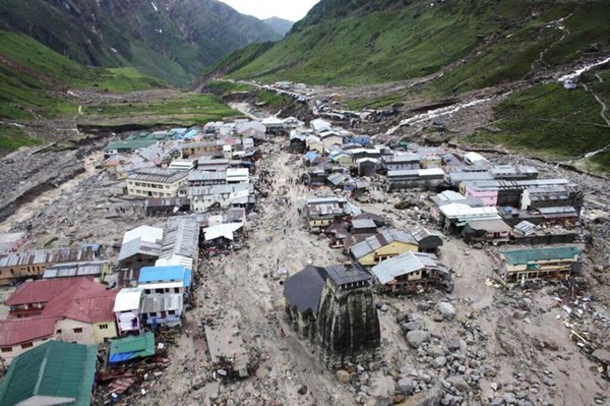 The Kedarnath Temple, center, stands amid the flood destruction June 18, 2013, in the northern Indian state of Uttarakhand.