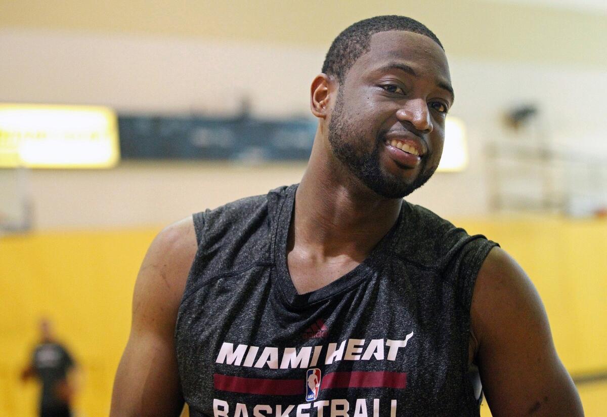 Miami's Dwyane Wade cracks a smile during a practice at AmericanAirlines Arena on Monday. Wade and the Heat will be facing the San Antonio Spurs for the second year in a row in the NBA Finals beginning Thursday in San Antonio.