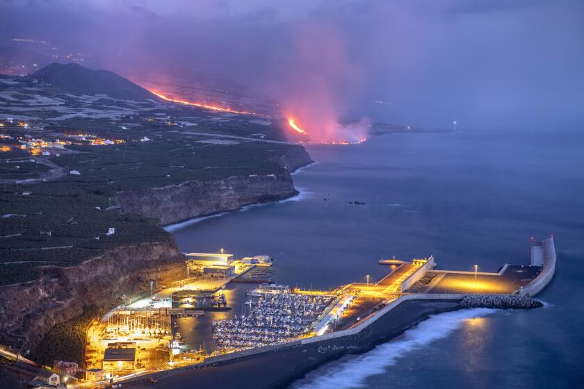Lava from a volcano reaches the sea on the Canary island of La Palma, Spain, Wednesday Sept. 29, 2021. Lava from a volcano that erupted Sept. 19 on Spain's Canary Islands has finally reached the Atlantic Ocean after wiping out hundreds of homes and forcing the evacuation of thousands of residents. (AP Photo/Saul Santos)
