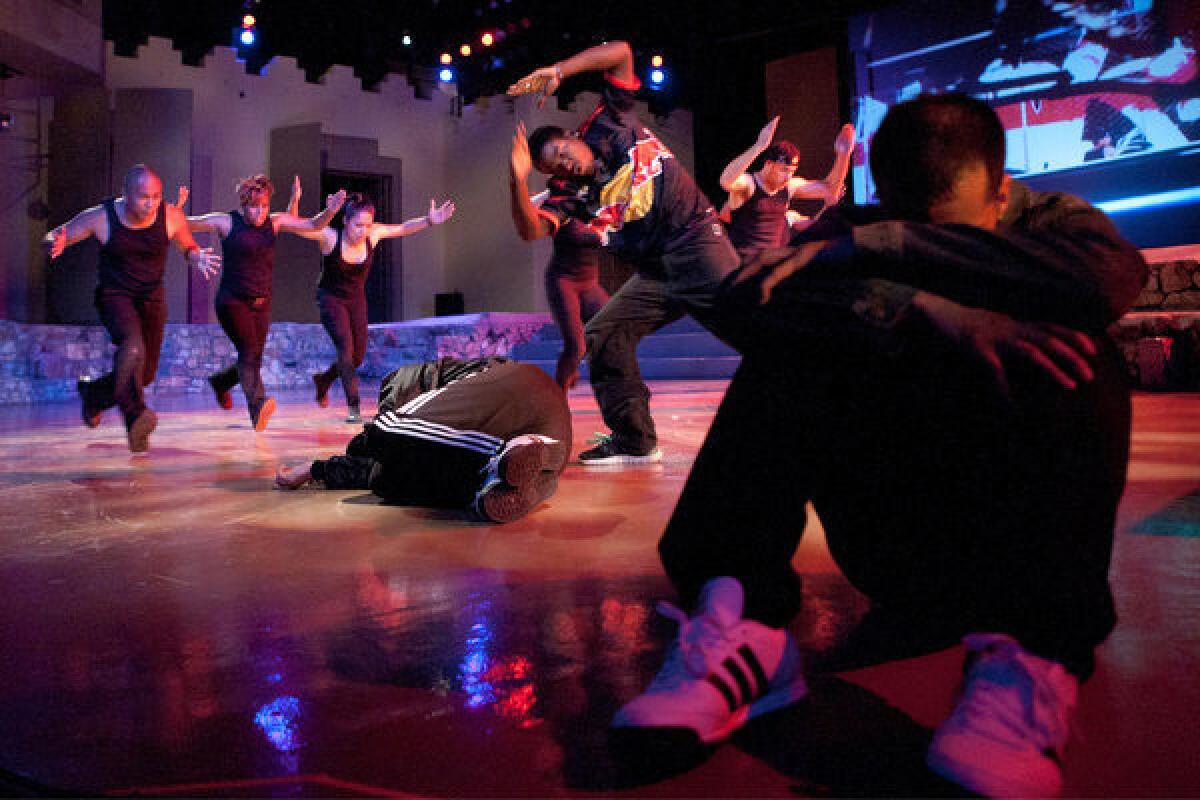 Antics performs at Ford Amphitheatre, from left, James "Jae Boogie" Datu, Cyrian Reed, Liliana Frias, Gilyon "Gillatine" Brace-Wessel (on ground), Kirlew "Bliss" Vilbon (in red bull shirt), Mike "Shockwave" Hummer (in back) and John "Random1" Molina (seated in foreground).