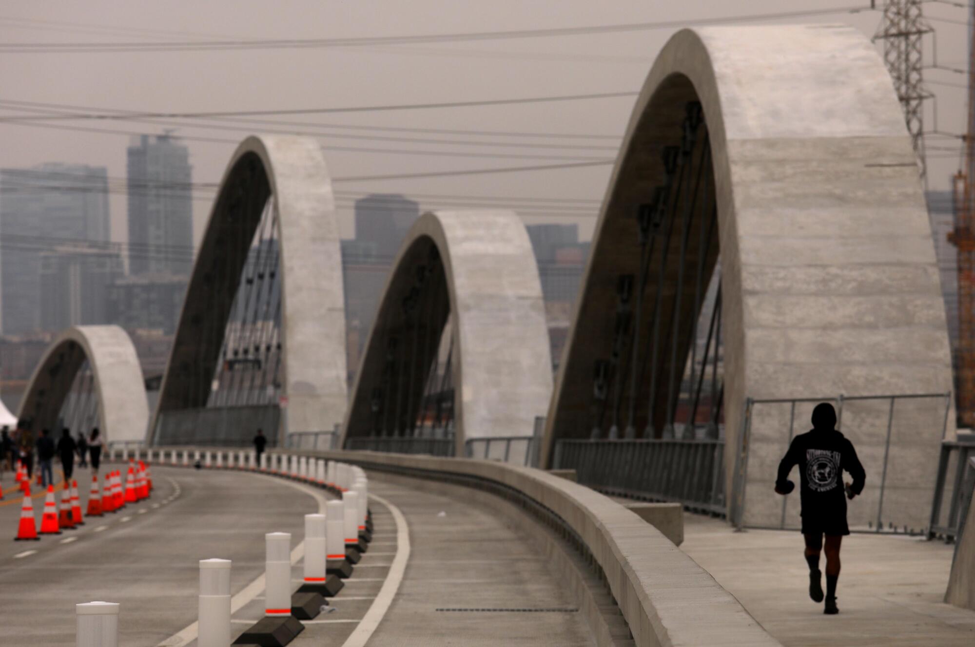 A jogger makes his way across the new 6th Street Viaduct.