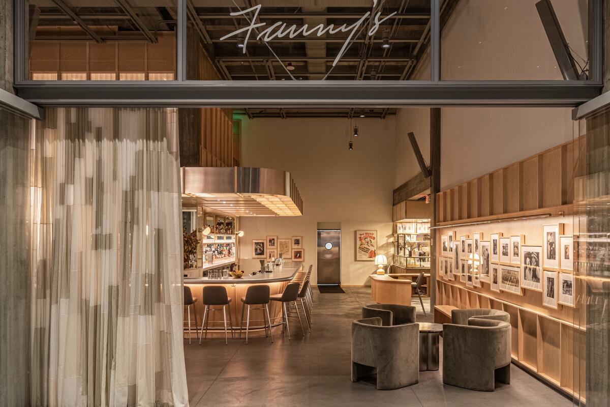 The entrance to a restaurant with barstools and low tables, with the word Fanny's over the door.