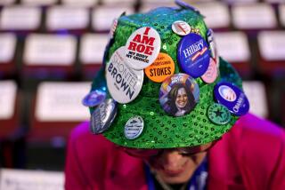 DNC CHICAGO, IL AUGUST 19, 2024 - Ohio celebration committee member Helen Sheehan shows her hat with political buttons on the floor of the 2024 Democratic National Convention in Chicago on Monday, August 19, 2024 in Chicago, IL. (Robert Gauthier/Los Angeles Times)