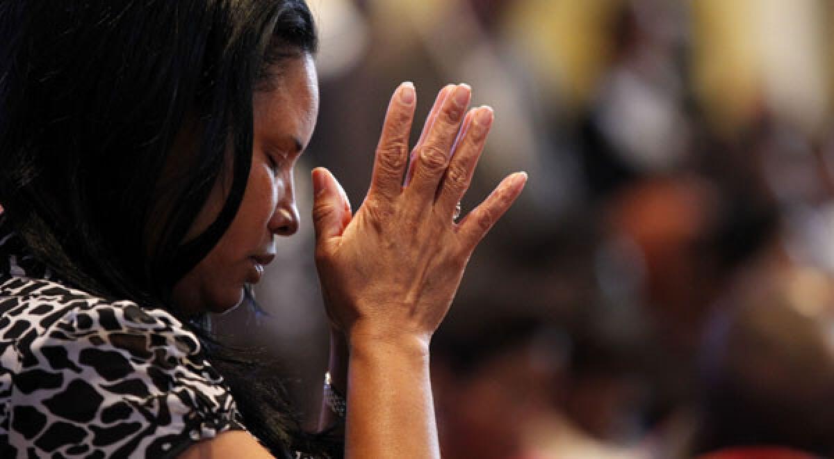 A worshiper at Franklin Avenue Baptist Church in New Orleans, whose pastor is the Rev. Fred Luter Jr., the first black president of the Southern Baptist Convention. A day after Luter was made president, the denomination took another step in its evolution by adopting an alternative name.