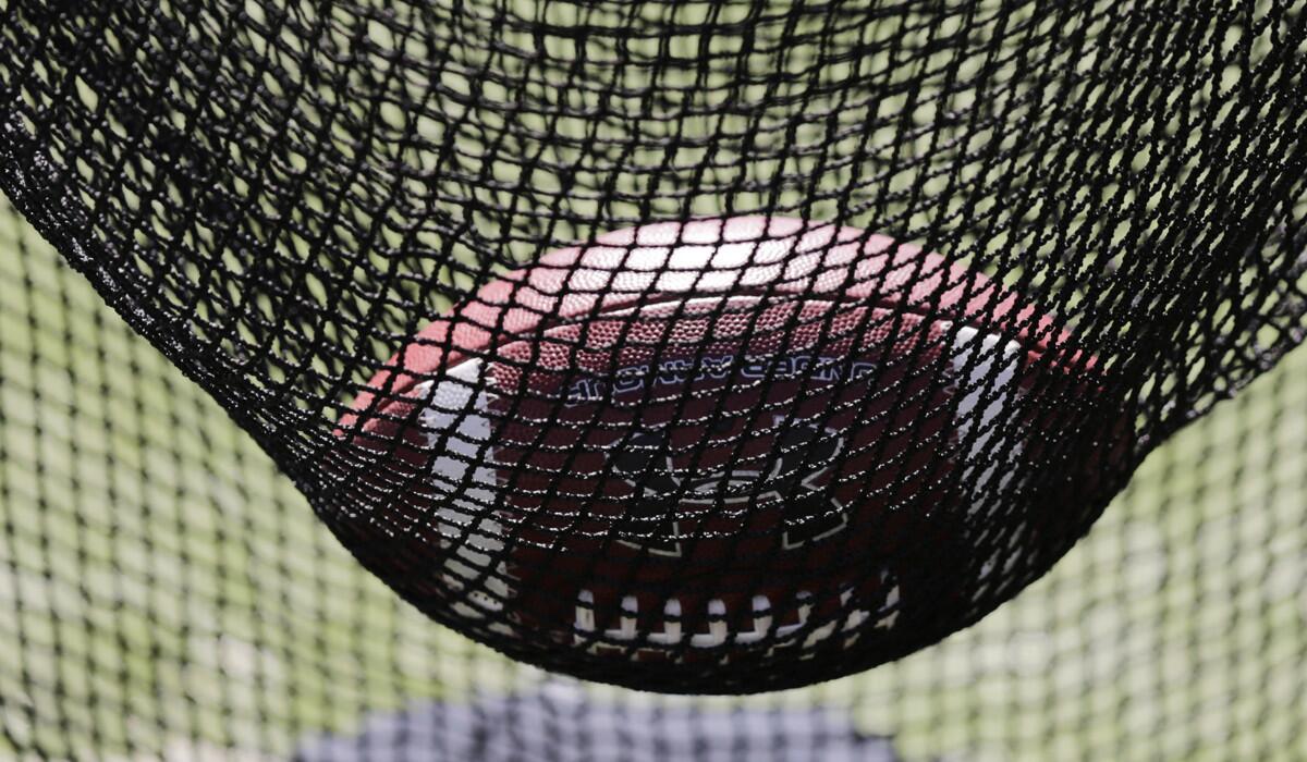 A football rests in sling during the Boston College spring football scrimmage game in Boston on April 16.
