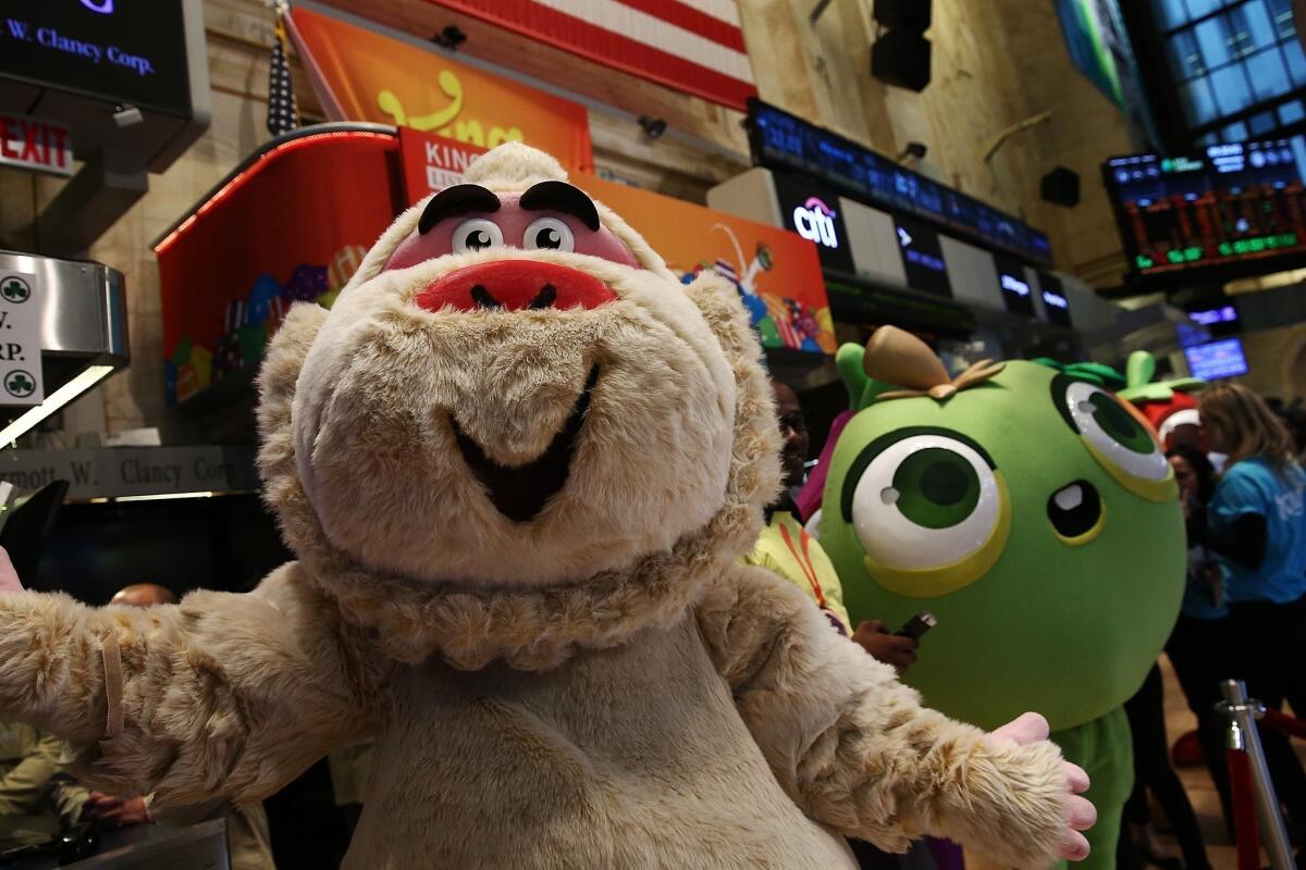 Characters from games made by King Digital Entertainment, maker of the popular Candy Crush game, roamed the floor of the New York Stock Exchange on Wednesday as the company made its Wall Street debut.